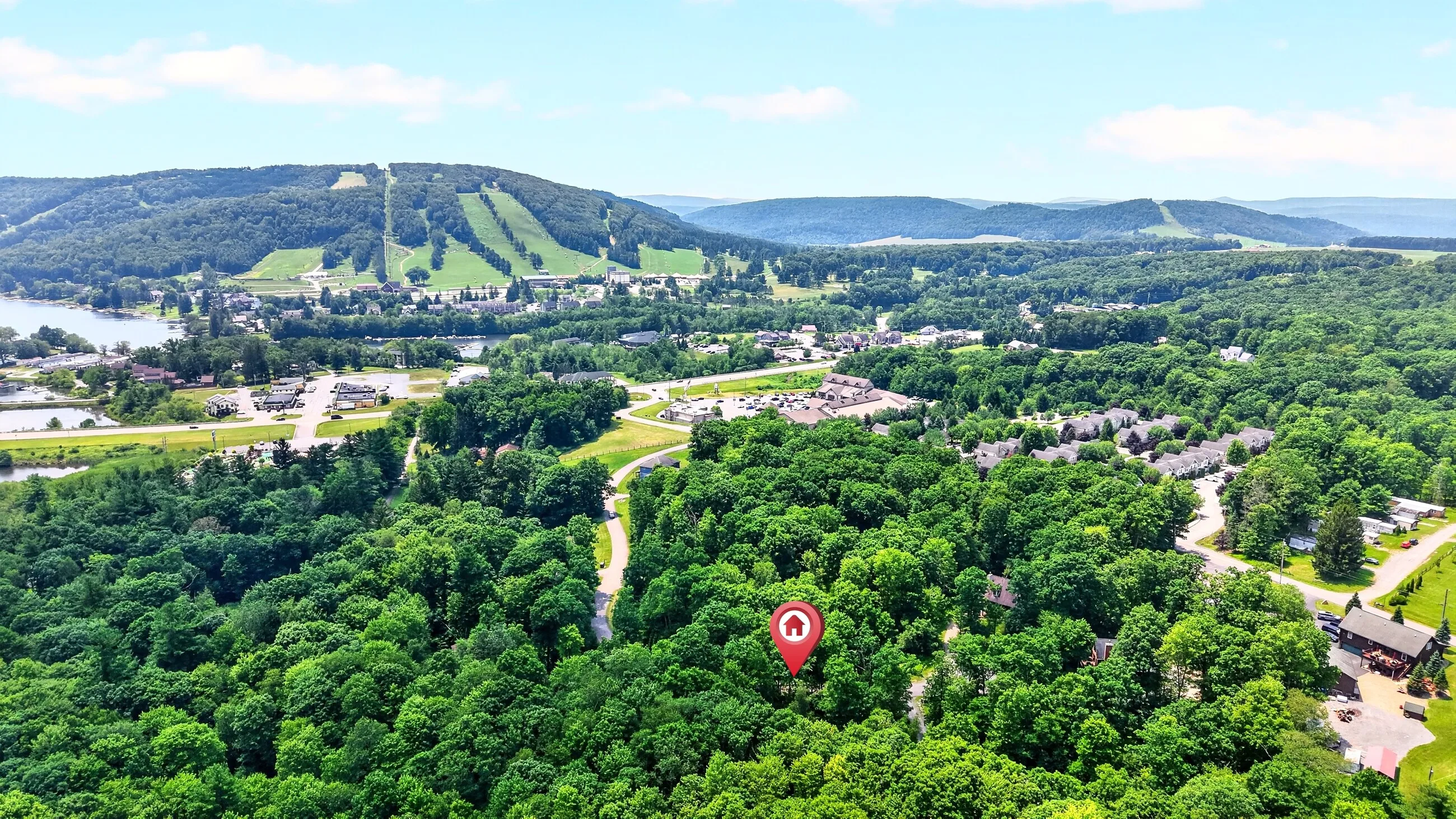Aerial view of the property against Deep Creek Lake and Wisp
